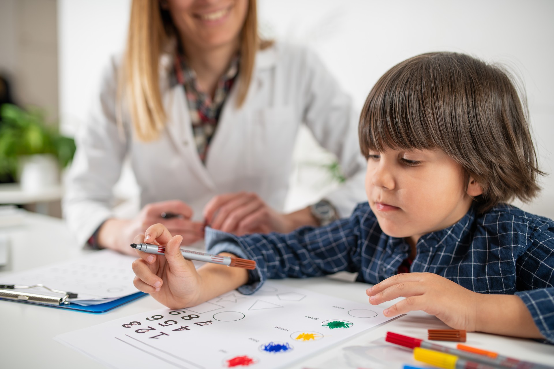 Curiosity of young minds as a toddler takes on a logic test involving numbers, exploration of early cognitive development.